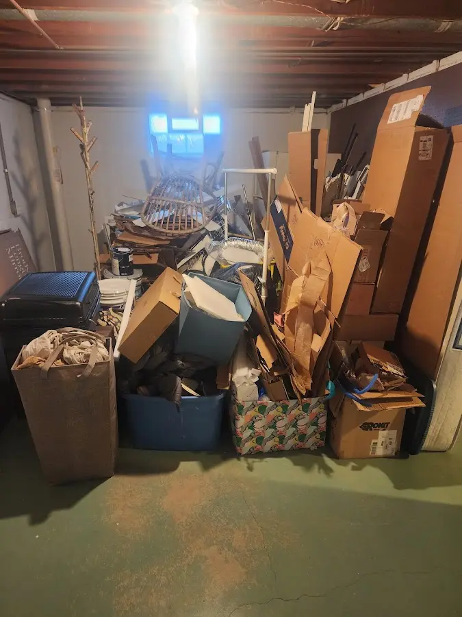 Roll-off dumpster container at job site for Yard Waste Dumpster Rental in Winterport